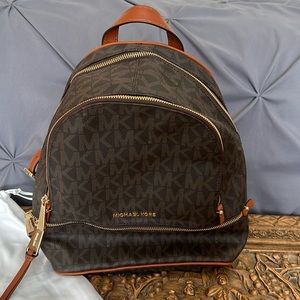 Brown leather Michael Kors logo backpack purse